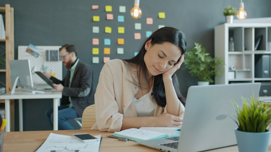 person feeling stressed at desk